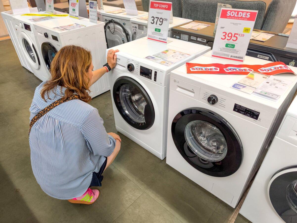 A woman looks at washing machines in Valence, France, on July 19, 2025. (Nicolas Guyonnet/Hans Lucas/AFP via Getty Images)