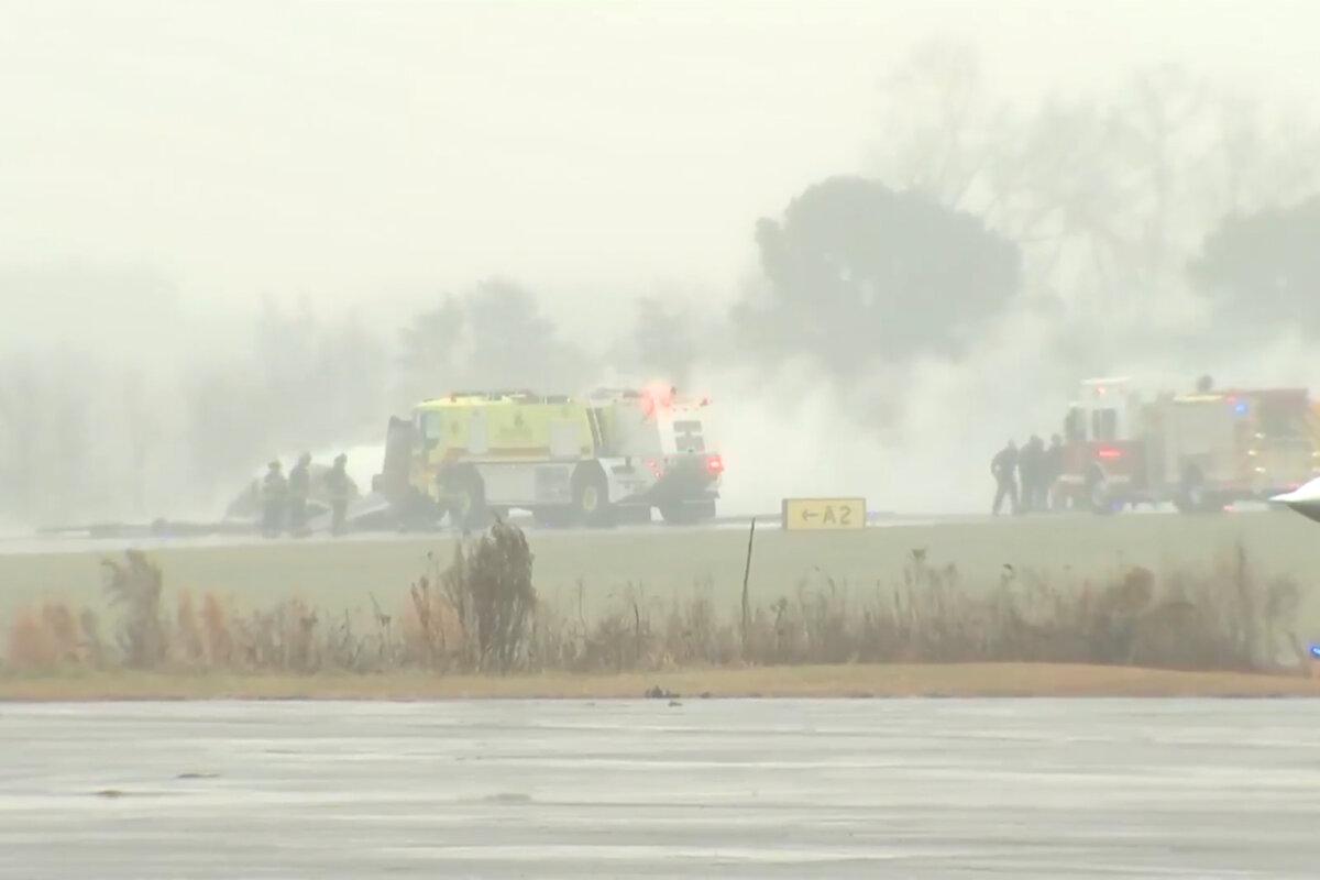 Firefighting crews respond to a reported plane crash at a regional airport in Statesville, N.C., on Dec. 18, 2025, in a still from video. (WSOC via AP)