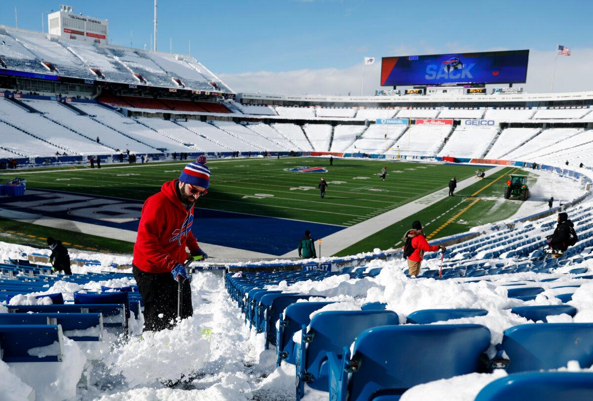 Rob Limoncelli shovels snow before the AFC Wild Card playoff game between the Buffalo Bills and Pittsburgh Steelers at Highmark Stadium in Buffalo, N.Y., on Jan. 15, 2024. (Sarah Stier/Getty Images)