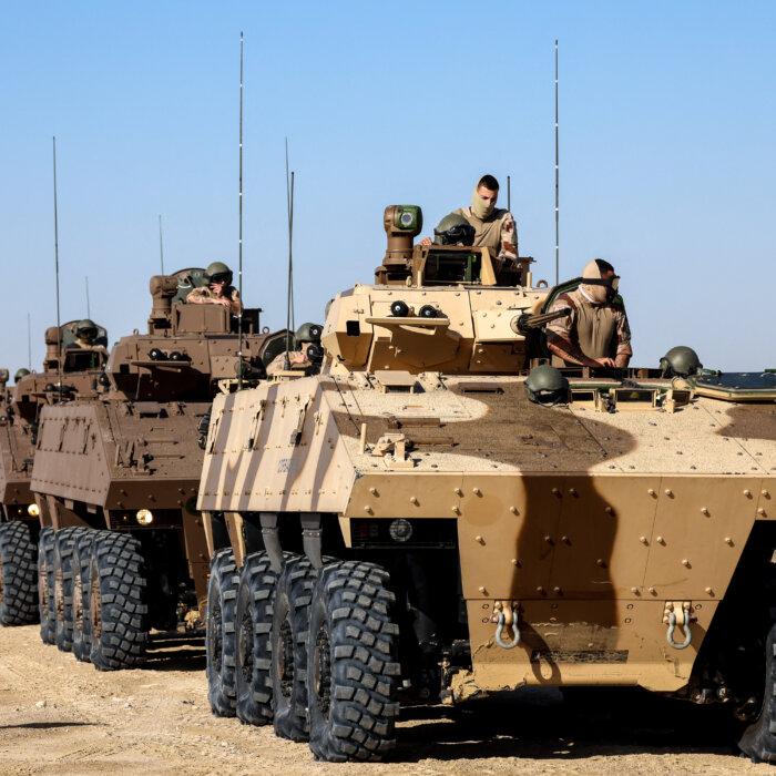 Day in Photos: French Troops in UAE, Protests in Bolivia, and Blue House in Seoul