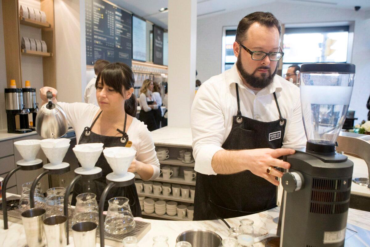 <span style="font-weight: 400;">Baristas work at at a coffee shop in Toronto in a file photo. (The Canadian Press/Chris Young)</span>