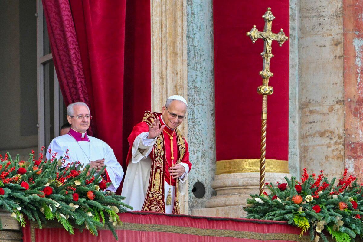 Pope Leo XIV waves to the faithfull at the main balcony of St. Peter's basilica at St Peter's square before making an address as part of the Christmas Day celebrations in the Vatican on Dec. 25, 2025. (Andreas Solaro/AFP)