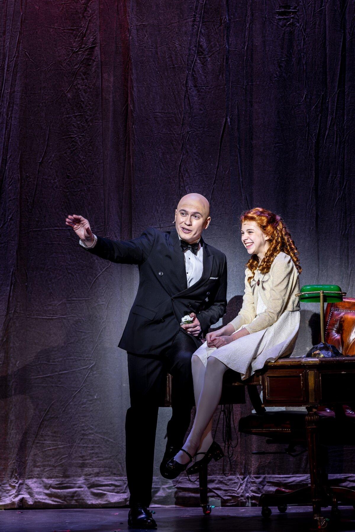 Billionaire Oliver Warbucks (Michael Metcalf) takes a shine to the cheerful orphan Annie. (Brett Beiner)
