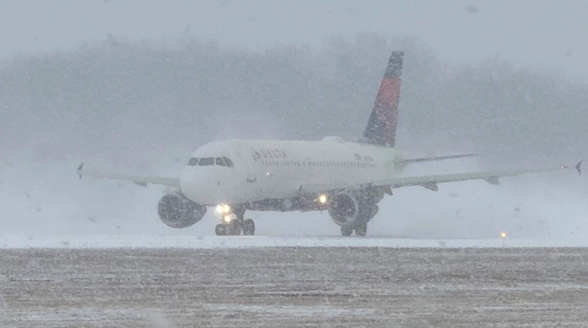 In this screengrab obtained from a social media video, a Delta Air Lines plane prepares to take off during a winter storm at Greater Rochester International Airport in Rochester, N.Y., on Dec. 26, 2025. (Joseph Frascati via Reuters)