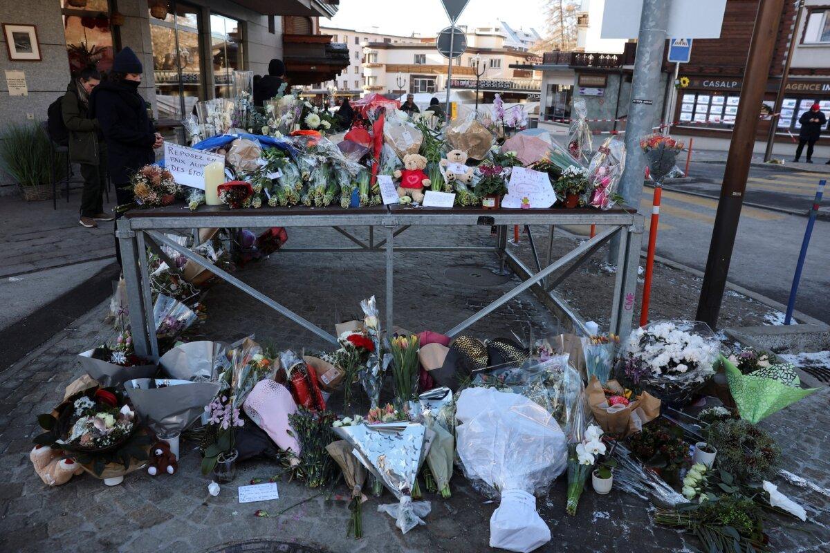 Floral tributes and stuffed teddy bears outside the "Le Constellation" bar, in Crans-Montana, Switzerland, on Jan. 2, 2026. (Stephanie Lecocq/Reuters)
