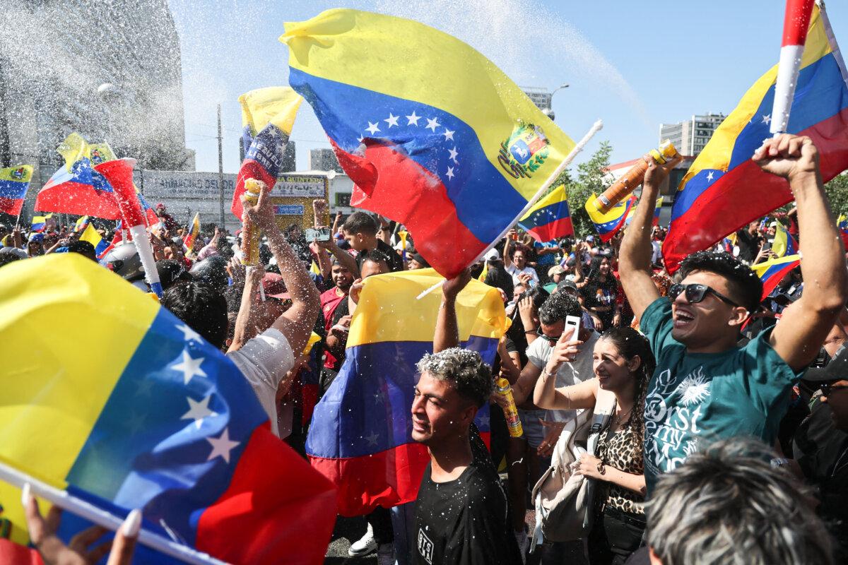 Venezuelans living in Chile celebrate in Santiago on Jan. 3, 2026, after U.S. forces captured Venezuelan leader Nicolás Maduro after launching a strike on Venezuela. (Javier Torres/AFP via Getty Images)