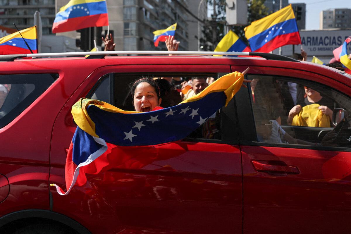 Venezuelans living in Chile celebrate following U.S. forces' capture of Venezuelan leader Nicolás Maduro after launching a strike on Venezuela, in Santiago, Chile, on Jan. 3, 2026. (Javier Torres/AFP via Getty Images)