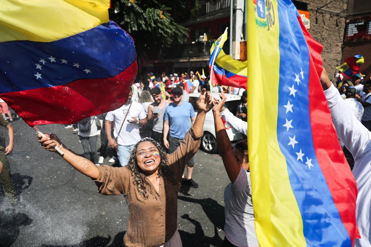 Venezuelans living in Chile celebrate in Santiago on Jan. 3, 2026, after U.S. forces captured Venezuelan leader Nicolás Maduro after launching a strike on Venezuela. (Javier Torres/AFP via Getty Images)