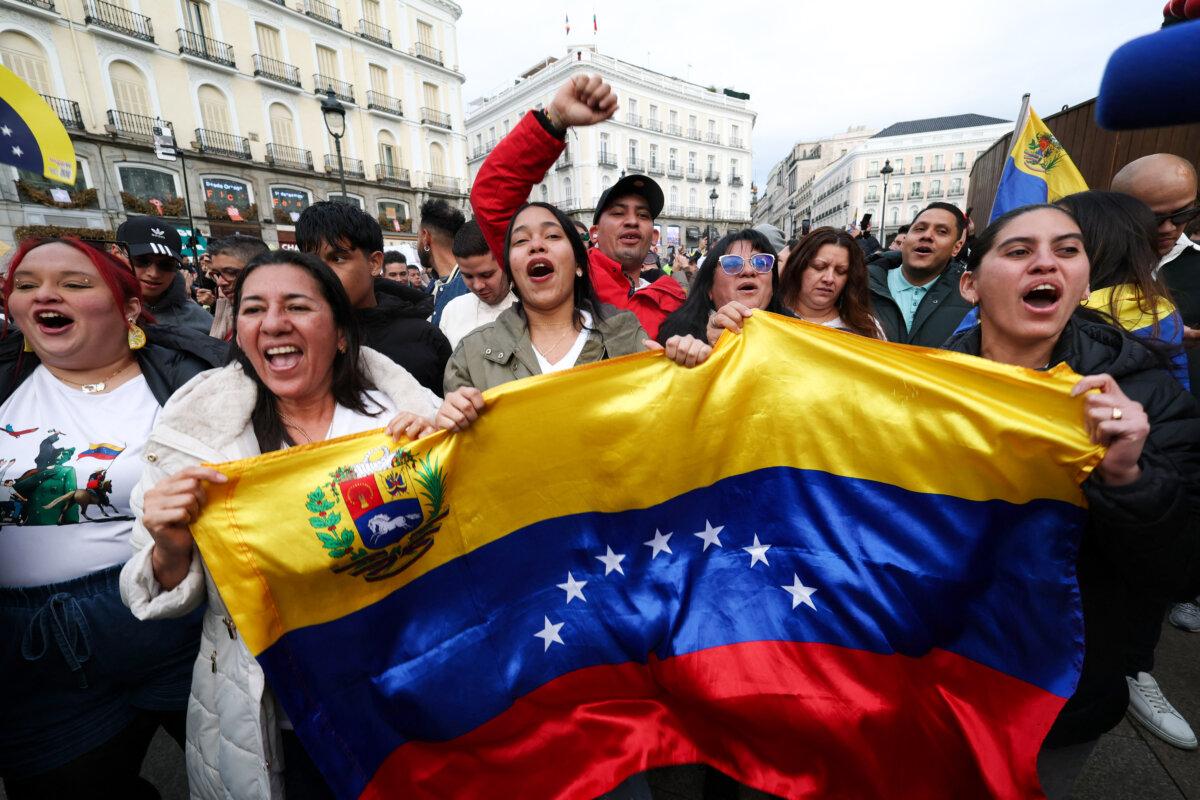 Venezuelan citizens living in Spain celebrate at Puerta del Sol square in Madrid on Jan. 3, 2026, after US forces captured Venezuelan leader Nicolás Maduro after launching a “large scale strike” on Venezuela. (Pierre-Philippe Marcou/AFP via Getty Images)