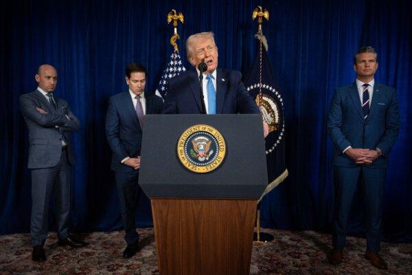 President Donald Trump, alongside (L–R) Deputy Chief of Staff Stephen Miller, Secretary of State Marco Rubio, and Secretary of War Pete Hegseth, speaks to the press following U.S. military actions in Venezuela, at his Mar-a-Lago residence in Palm Beach, Fla., on Jan. 3, 2026. (Jim Watson/AFP via Getty Images)