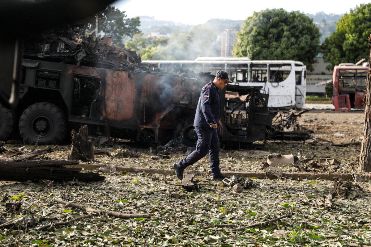 A firefighter walks past a destroyed anti-aircraft unit at La Carlota military air base, after U.S. President Donald Trump said the U.S. has struck Venezuela and captured its leader Nicolás Maduro, in Caracas, Venezuela, on Jan. 3, 2026. (REUTERS/Leonardo Fernandez Viloria)