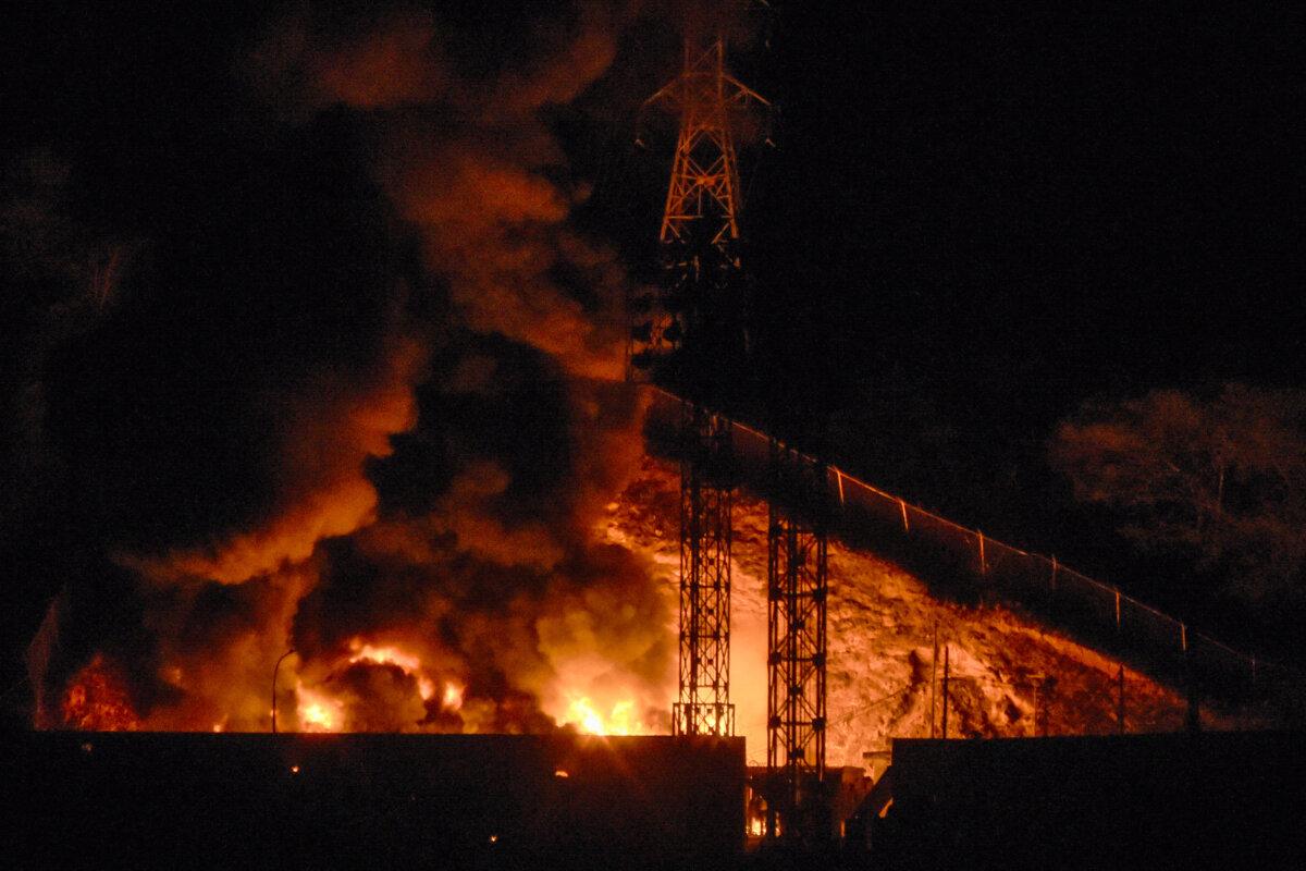 Picture of fire at Fuerte Tiuna, Venezuela's largest military complex, after a series of explosions in Caracas, Venezuela, on Jan. 3, 2026. Loud explosions, accompanied by sounds resembling aircraft flyovers, were heard in Caracas around 2:00 am (0600 GMT) on Jan. 3, an AFP journalist reported. (Luis JAIMES / AFP via Getty Images)