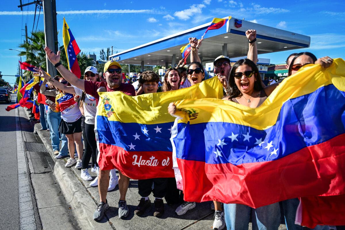 People celebrate the news of the capture of Venezuelan leader Nicolás Maduro by the U.S. military, in Doral, Fla., on Jan. 3, 2026. (Giorgio Viera/AFP via Getty Images)