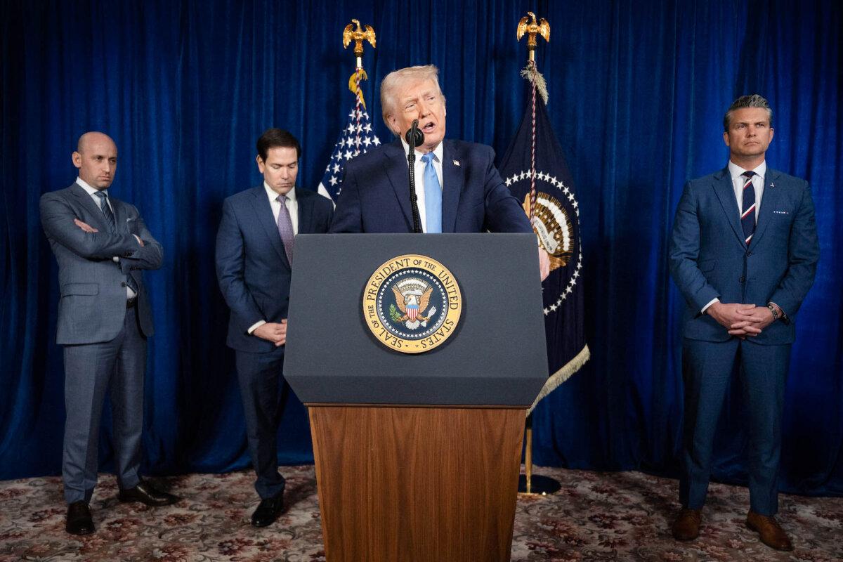President Donald Trump, alongside (L–R) deputy chief of staff Stephen Miller, Secretary of State Marco Rubio, and Secretary of War Pete Hegseth, speaks to reporters following U.S. military actions in Venezuela, at his Mar-a-Lago residence in Palm Beach, Fla., on Jan. 3, 2026. (Jim Watson/AFP via Getty Images)