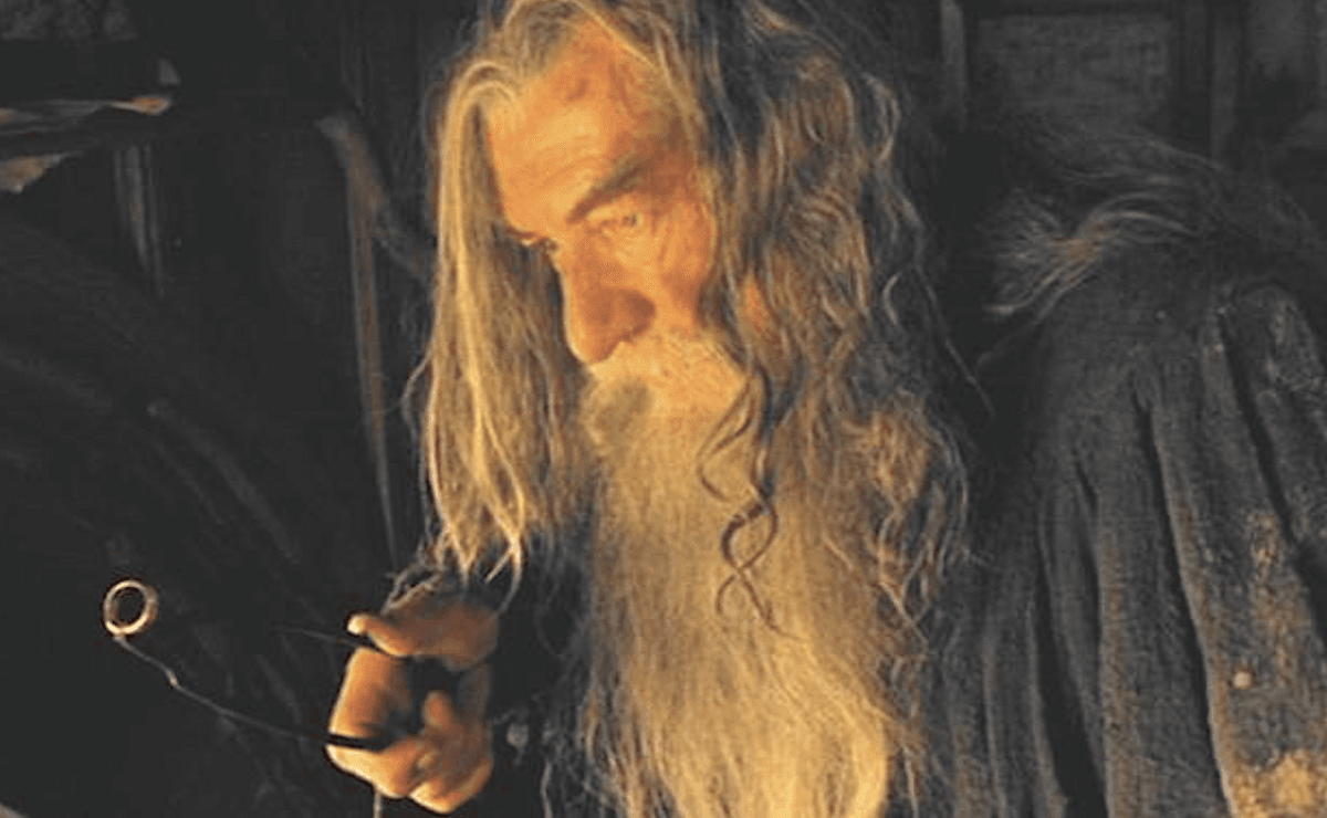 Gandalf the Grey (Ian McKellen) retrieves the One Ring from Bilbo's fireplace, in "The Lord of the Rings: The Fellowship of the Ring." (New Line Cinema)