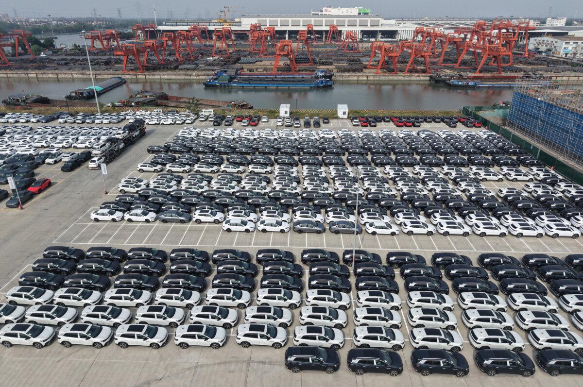 An aerial view shows new cars waiting to be loaded for export at a port in Hangzhou, China, on Nov. 10, 2025. (AFP via Getty Images)