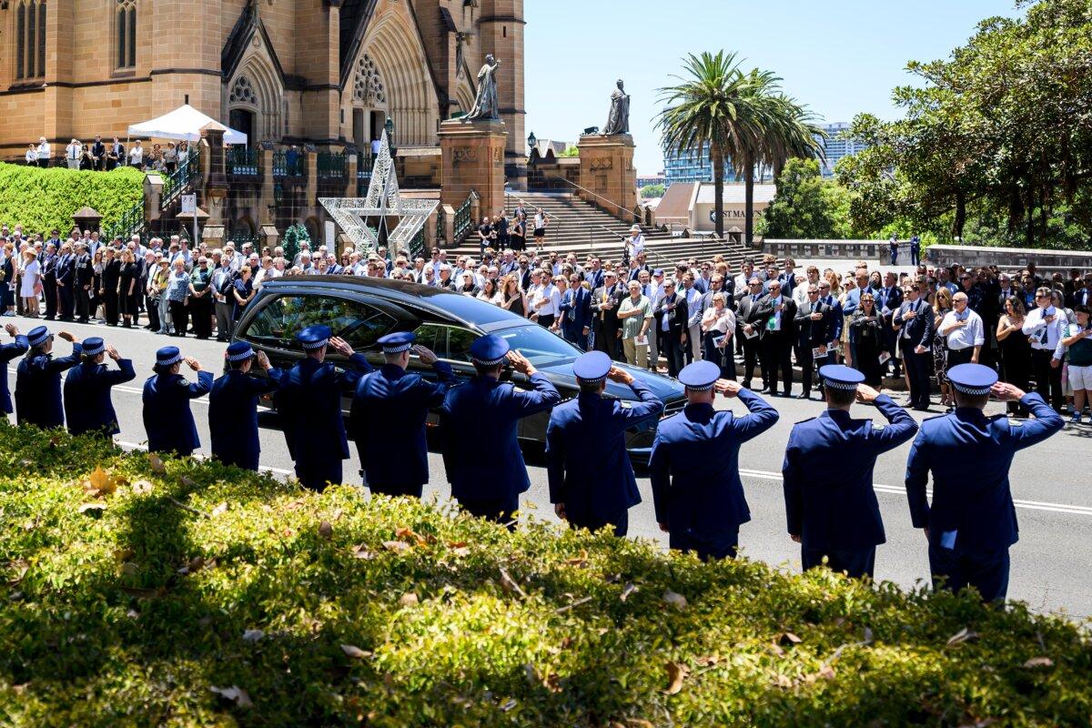 Members of the NSW Police force stand in line of honour at St Mary's Cathedral in Sydney, Australia, on Jan. 7, 2026. (AAP Image/Bianca De Marchi)