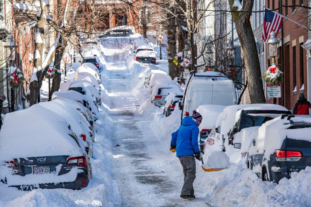 A person shovels snow in Boston, Mass., on Jan. 30, 2022. (Joseph Prezioso/AFP via Getty Images)