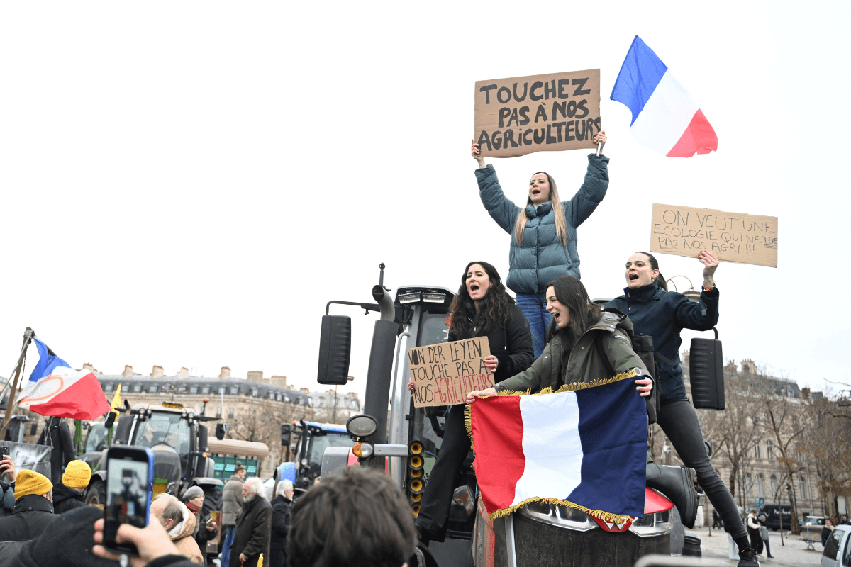 Women atop a tractor support farmers as they protest at the Arc de Triomphe against the European Union's negotiations over the Mercosur trade deal with five South American nations, in Paris on Jan. 8, 2026. (Emma Da Silva/AP Photo)
