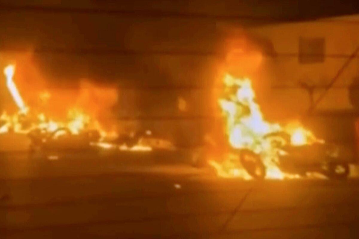 This frame grab from a video released by Iran state TV shows vehicles burning amid a night of mass protests in Tehran, Iran, on Jan. 8, 2026. (Iran state TV via AP)