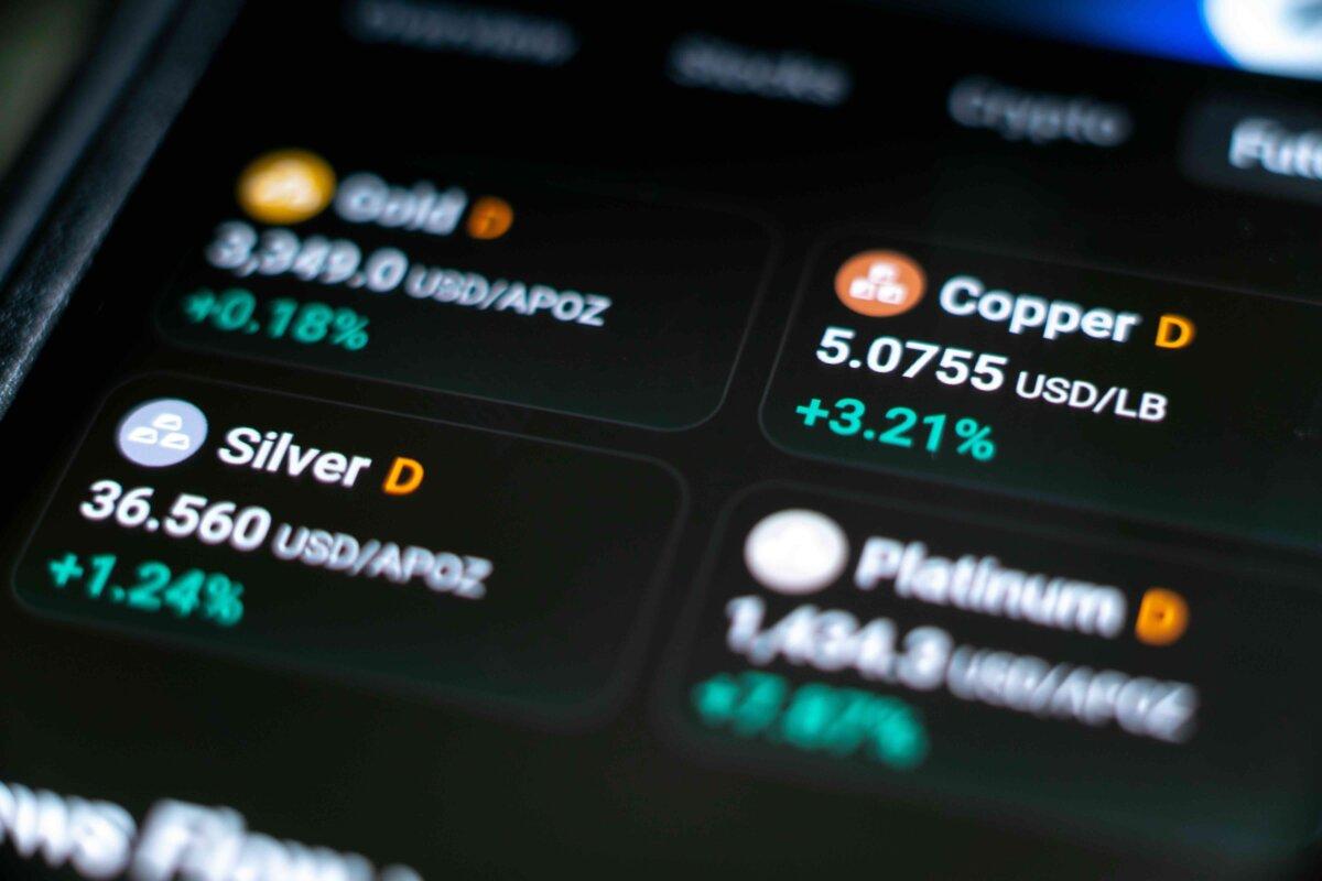 Gold, silver, copper, and platinum futures charts are seen on a mobile trading screen in Denver, Colorado, on June 26, 2025. (PJ McDonnell/Shutterstock)