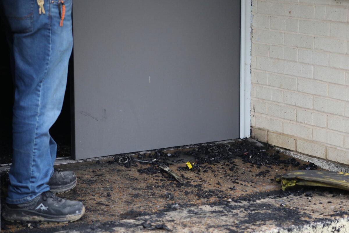 Zach Shemper, president of Beth Israel Congregation, stands in ashes outside the congregation’s temple hours after the building was damaged by fire, in Jackson, Miss., on Jan. 10, 2026. (Allen Siegler/Mississippi Today via AP)