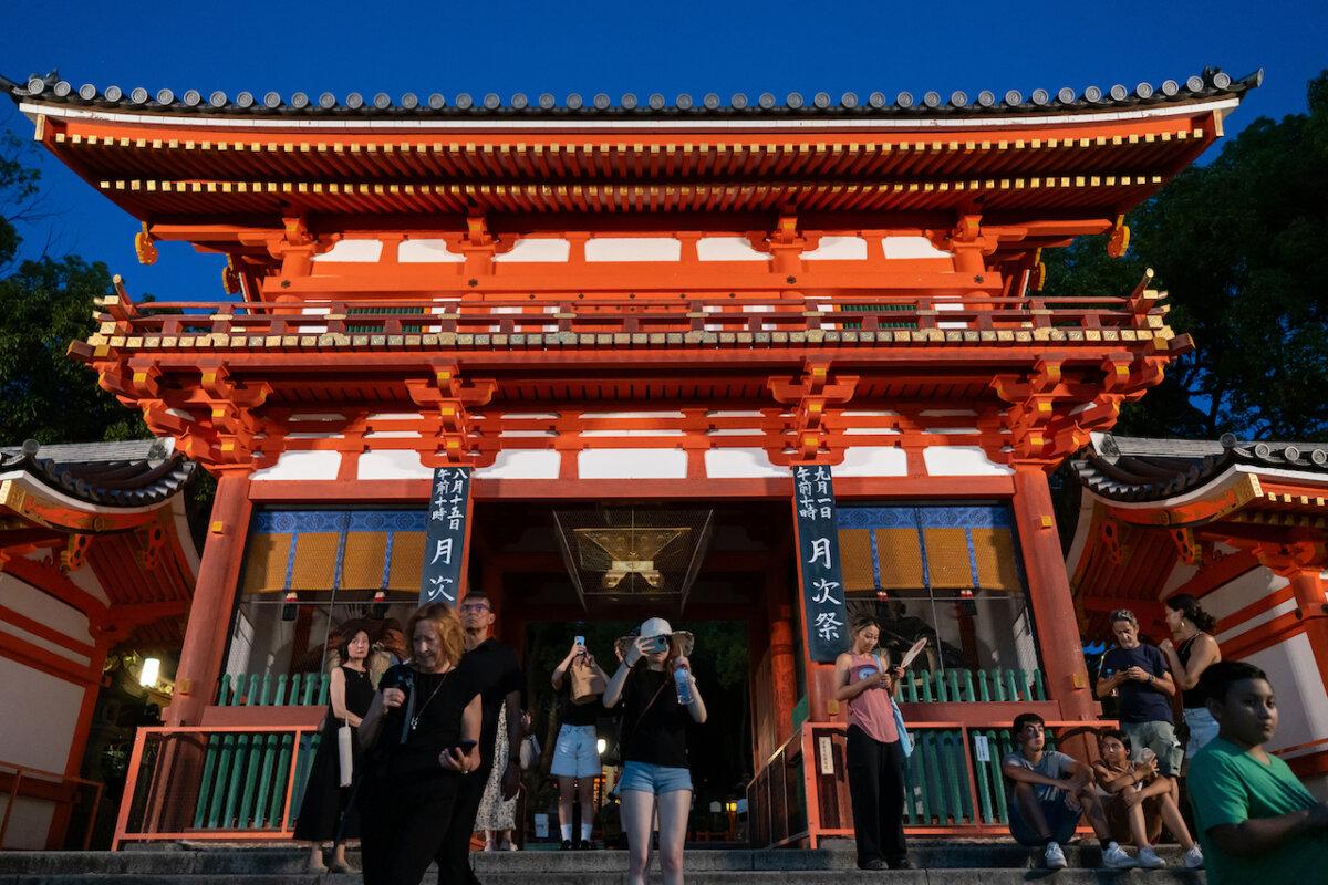 Tourists visit the Yasaka Shrine at night on August 08, 2024 in Kyoto, Japan. The Japan National Tourism Organization released on July 19 that more than 17.7 million foreign visitors entered Japan from January through June this year, recording the highest number for the first half of a year. (Photo by Tomohiro Ohsumi/Getty Images)