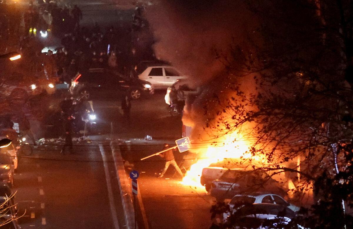 Iranian demonstrators gather in a street during a protest over the collapse of the currency's value, in Tehran, Iran, Jan. 8, 2026. (Stringer/West Asia News Agency via Reuters)