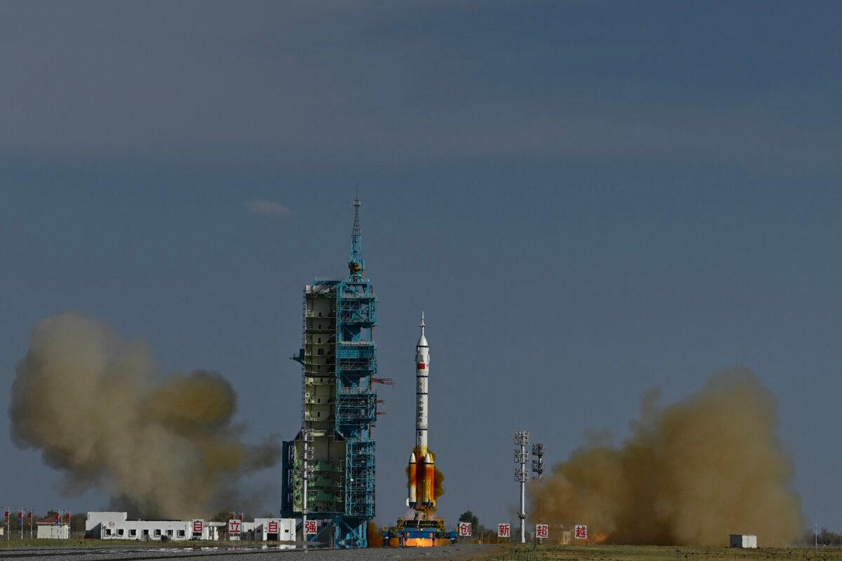 A Long March-2F carrier rocket, carrying the Shenzhou-20 spacecraft and a crew of three astronauts, lifts off from the Jiuquan Satellite Launch Centre in the Gobi desert, in northwest China, on April 24, 2025. (Pedro Pardo/AFP via Getty Images)