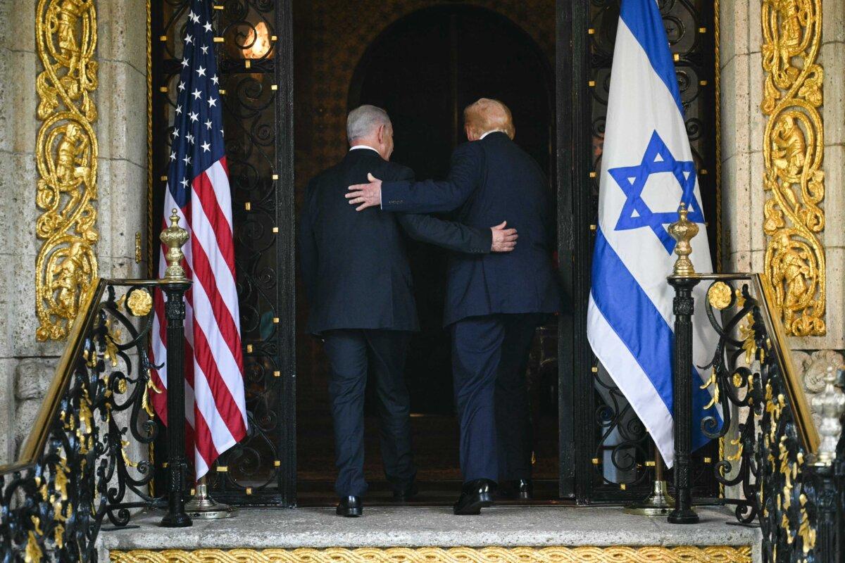 President Donald Trump and Israeli Prime Minister Benjamin Netanyahu walk inside after Netanyahu arrived at Trump’s Mar-a-Lago residence in Palm Beach, Fla., on Dec. 29, 2025. (Jim Watson/AFP via Getty Images)