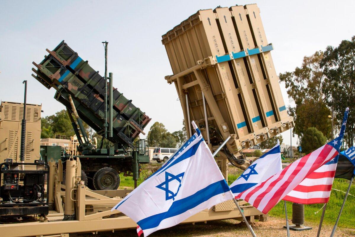 An Israeli Iron Dome anti-rocket system and a U.S. Patriot missile defense system are exposed during the Israeli–U.S. military exercise “Juniper Cobra” at the Hatzor Air Force Base, Israel, on March 8, 2018. (Jack Guez/AFP via Getty Images)