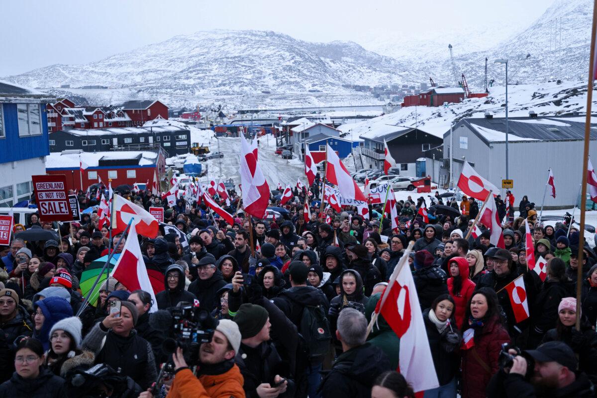 People bear Greenlandic flags as they march to protest against U.S. President Donald Trump and his announced intent to acquire Greenland, in Nuuk, Greenland, on Jan. 17, 2026. (Sean Gallup/Getty Images)