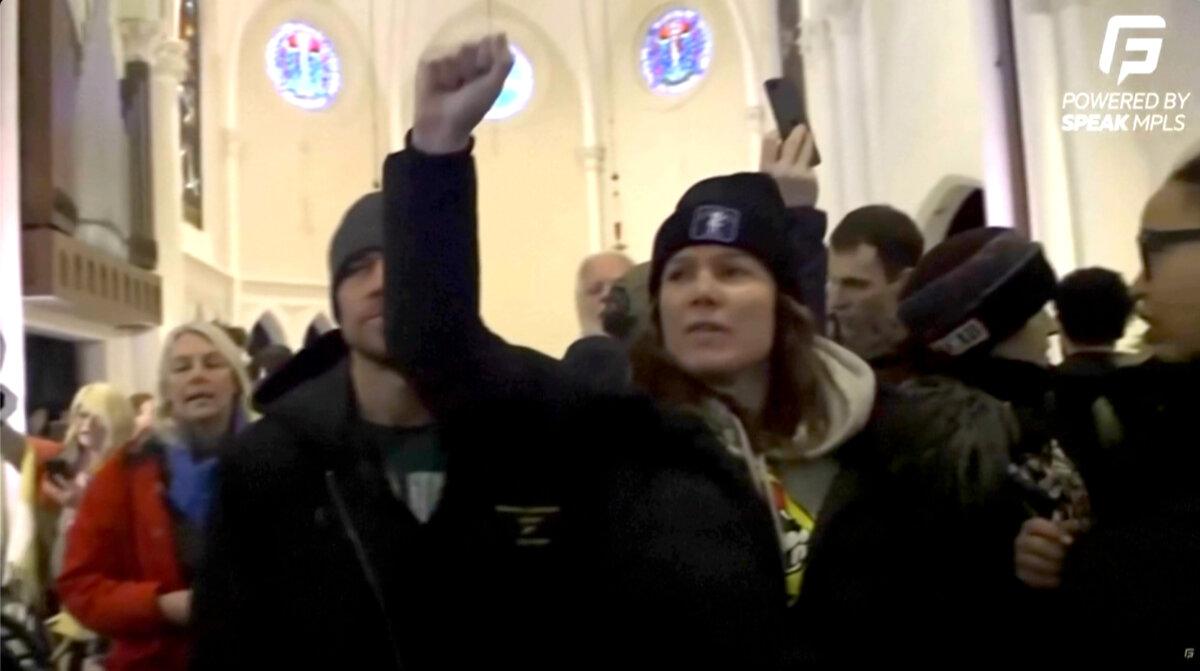 Protesters disrupt services at the Cities Church in St. Paul, Minn., on Jan. 18, 2026, in this still from video. (Speak MLPS via AP/Screenshot via The Epoch Times)