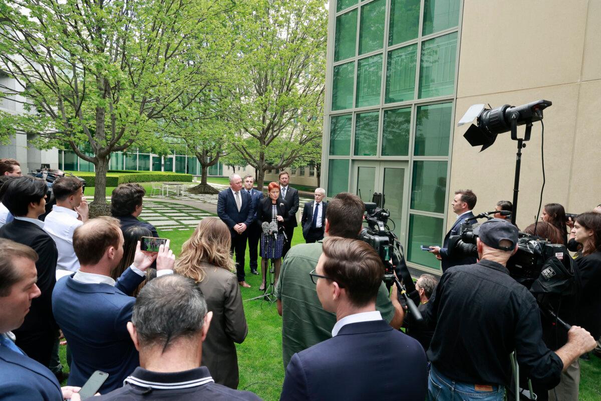 One Nation Leader Pauline Hanson (C) and other members of the One Nation Party address the media at Parliament House in Canberra, Australia, on Jan. 19, 2026. (Hilary Wardhaugh/Getty Images)