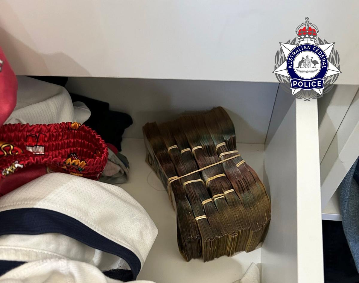 Sydney Man Charged With $3.5 Million NDIS Fraud Money found in the drawer at the home of a man charged with allegedly defrauding the NDIS of $3.5 million. (Courtesy of the Australian Federal Police)