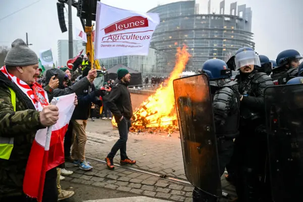 Day in Photos: Protests Near European Parliament, Blackout in Kyiv, and Northern Lights in Germany