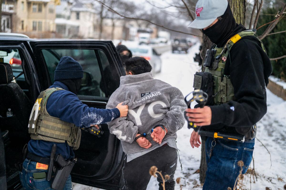 A man is detained by a Border Patrol agent in Minneapolis on Jan. 21, 2026. (Stephen Maturen/Getty Images)