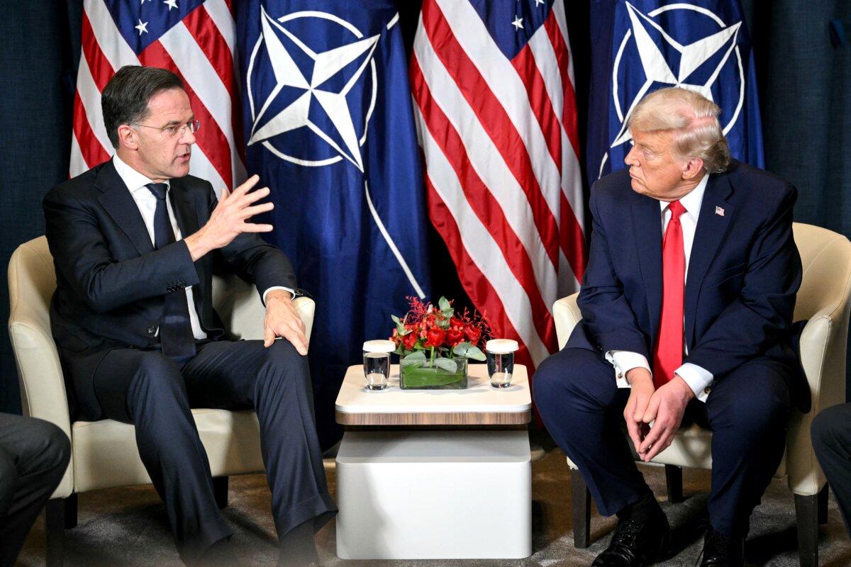 U.S. President Donald Trump (R) speaks with NATO Secretary-General Mark Rutte on the sidelines of the annual World Economic Forum meeting in Davos, Switzerland, on Jan. 21, 2026. (Mandel Ngan/AFP via Getty Images)