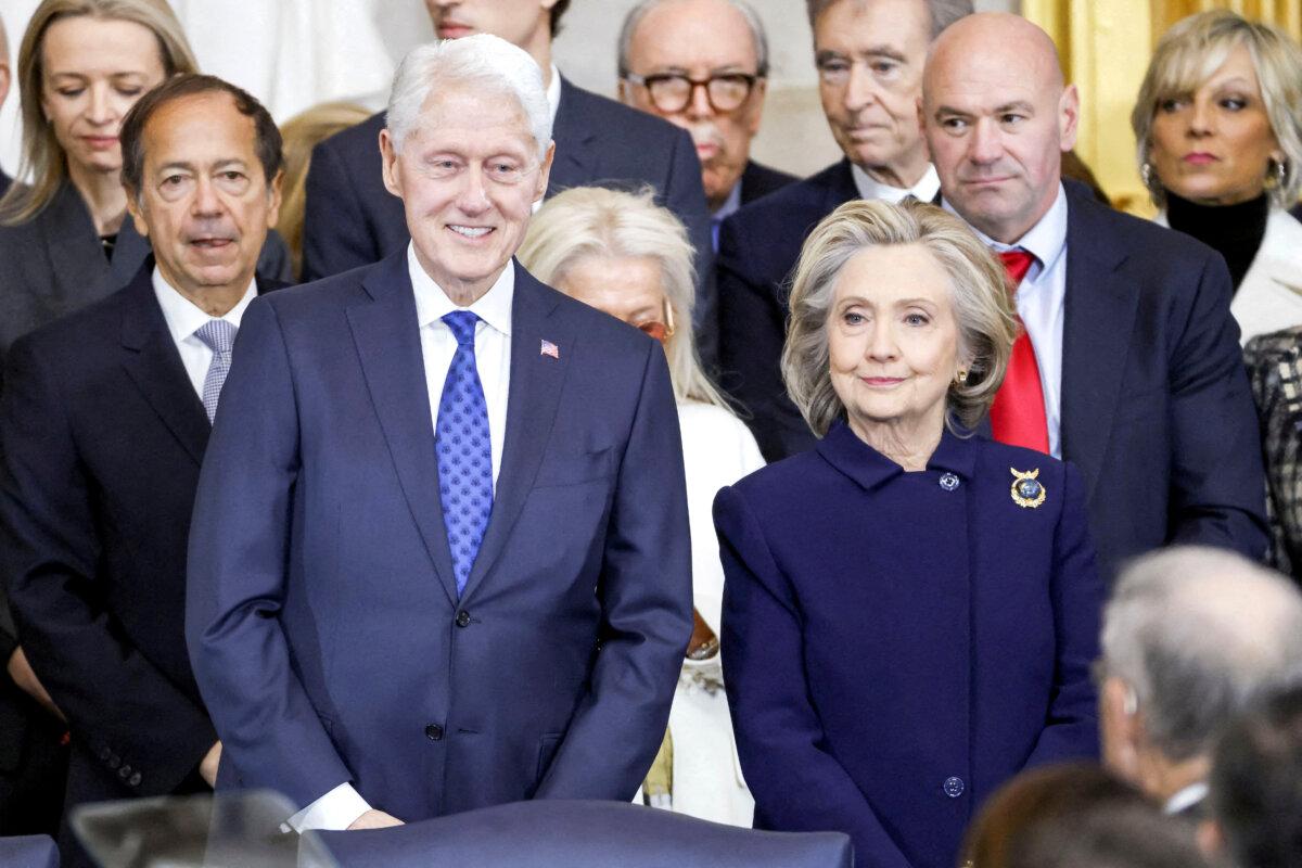 Former President Bill Clinton and former Secretary of State Hillary Clinton arrive for former President Donald Trump's inauguration as the next president of the United States in the Rotunda of the U.S. Capitol on Jan. 20, 2025. (Shawn Thew/Reuters)