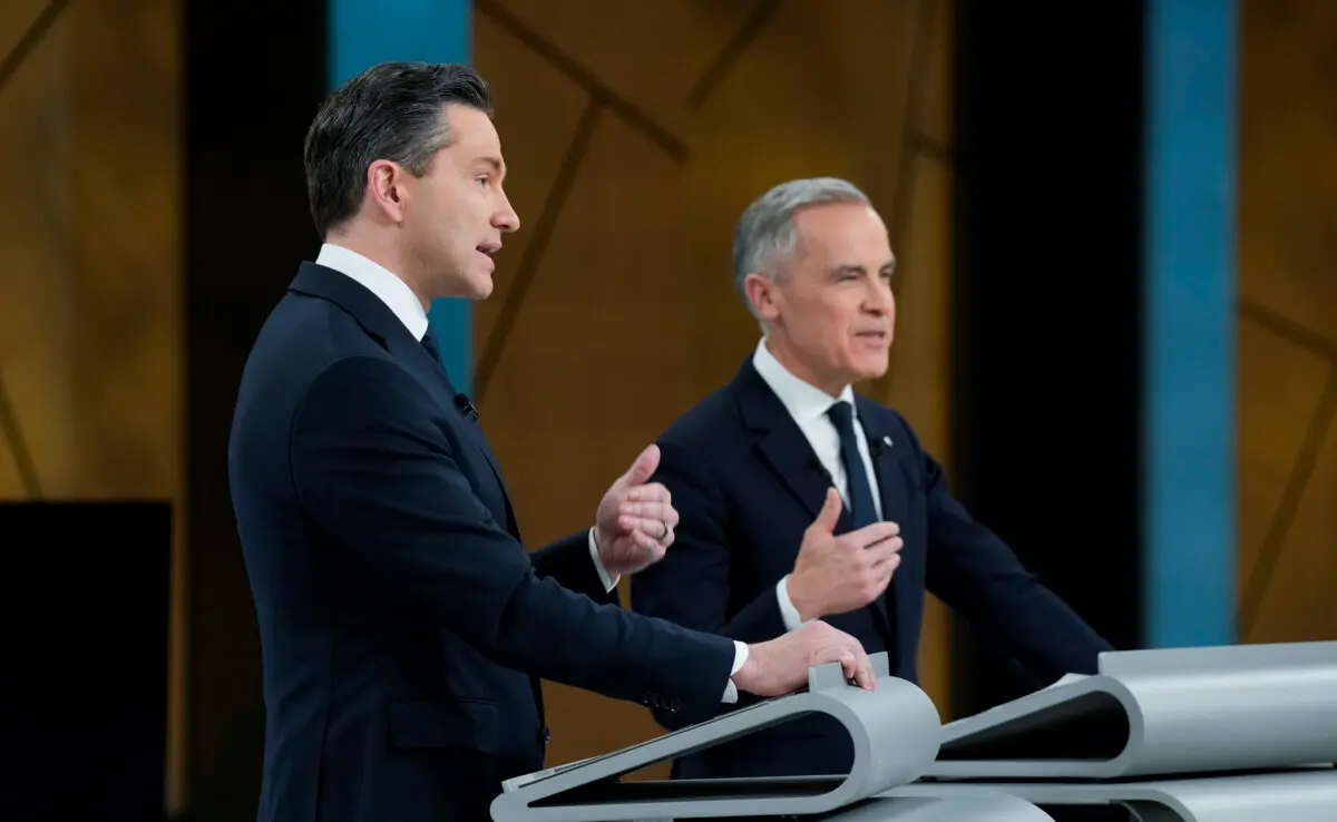Conservative Leader Pierre Poilievre and Prime Minister Mark Carney participate in the English-language federal leaders' debate in Montreal on April 17, 2025. (The Canadian Press/Adrian Wyld)