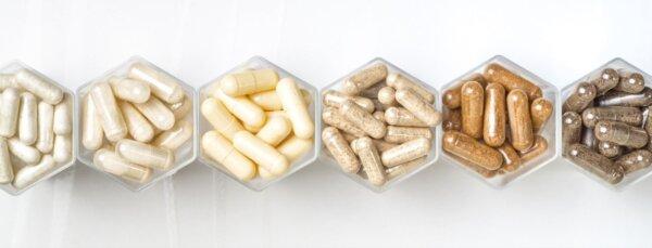 A clean display of different supplements designed for everyday wellness. (natagolubnycha/adobe stock)