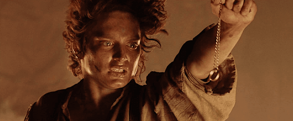 Frodo Baggins (Elijah Wood) attempts to let go of the mind-warping One Ring of Power, in "The Lord of the Rings: The Return of the King." (New Line Cinema)