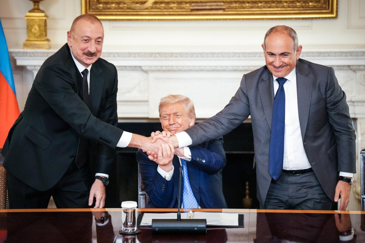 U.S. President Donald Trump (C) joins hands with Azerbaijani President Ilham Aliyev (L) and Armenian Prime Minister Nikol Pashinyan (R) during a signing ceremony at the White House on Aug. 8, 2025. (Andrew Harnik/Getty Images)