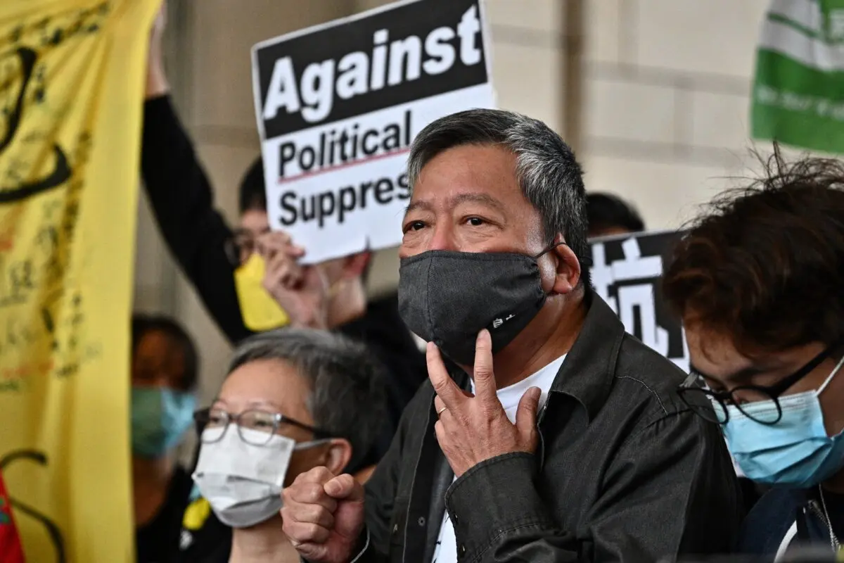 Pro-democracy activist Lee Cheuk-yan (C) arrives at West Kowloon court in Hong Kong on April 16, 2021. (Anthony Wallace/AFP via Getty Images)