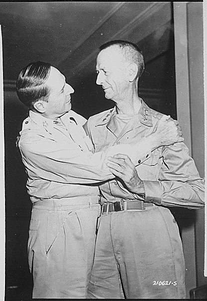 Gen. Douglas MacArthur greets Lt. Gen. Jonathan Wainwright at the New Grand Hotel in Yokohama, Japan, on Aug. 31, 1945. The uncharacteristic embrace between hardened soldiers was a result of acknowledging years of Japanese torture on Wainwright's side. (Public Domain)