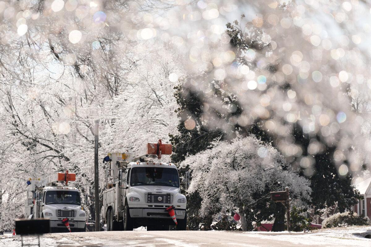 Utility trucks in Nashville on Jan. 28, 2026. (George Walker IV/AP Photo)