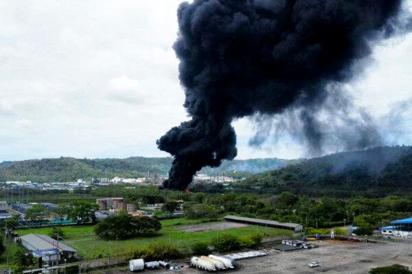 Day in Photos: Refinery on Fire, Rally in Bangkok, and Ice Floating in Russia