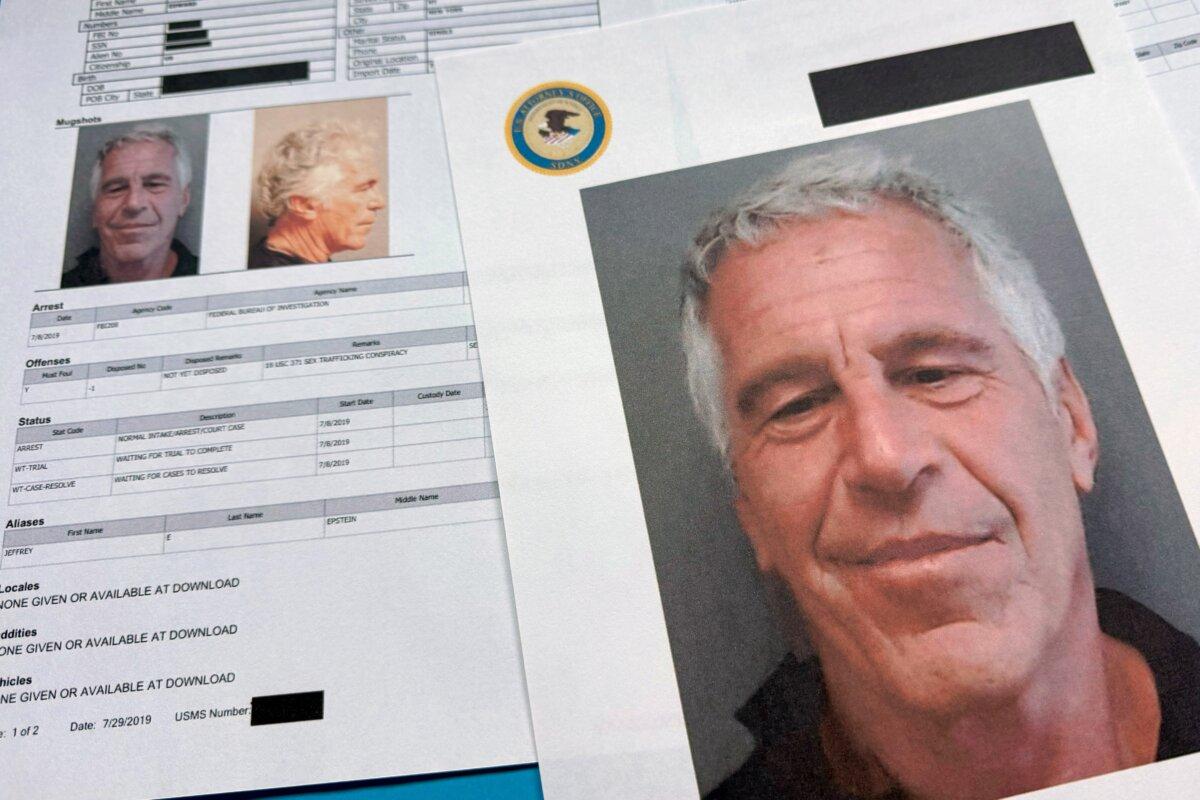 Documents released by the U.S. Department of Justice as photographed on Jan. 2, 2026. (Jon Elswick/AP Photo)