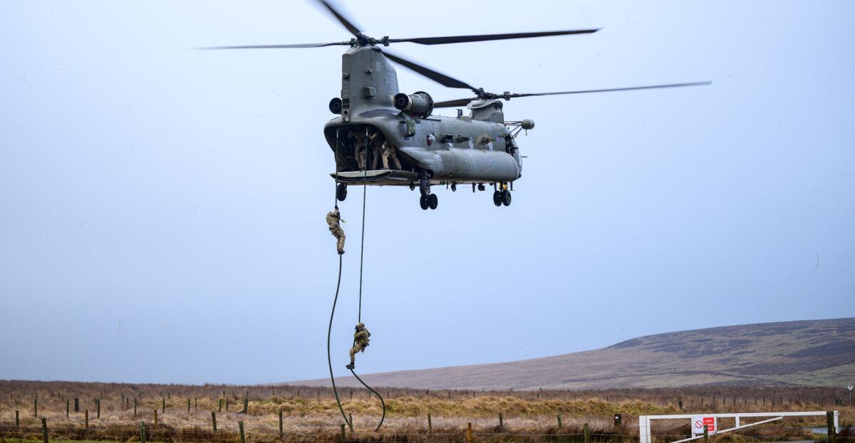 Members of the UK's Special Operations Forces fast-rope from a CH-47 Chinook helicopter during a validation exercise in Otterburn, England, on Jan. 31, 2026. (Leon Neal/Getty Images)