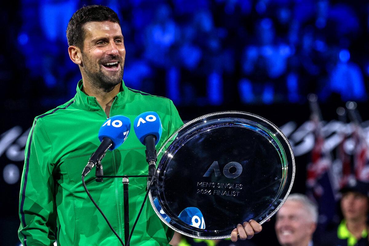 Serbia’s Novak Djokovic speaks after receiving the runner-up shield in the men’s singles final on Day 15 of the Australian Open tennis tournament in Melbourne on Feb. 1, 2026. (Izhar Khan/AFP via Getty Images)